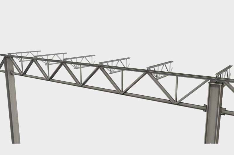 Metal truss bridge segment under construction.